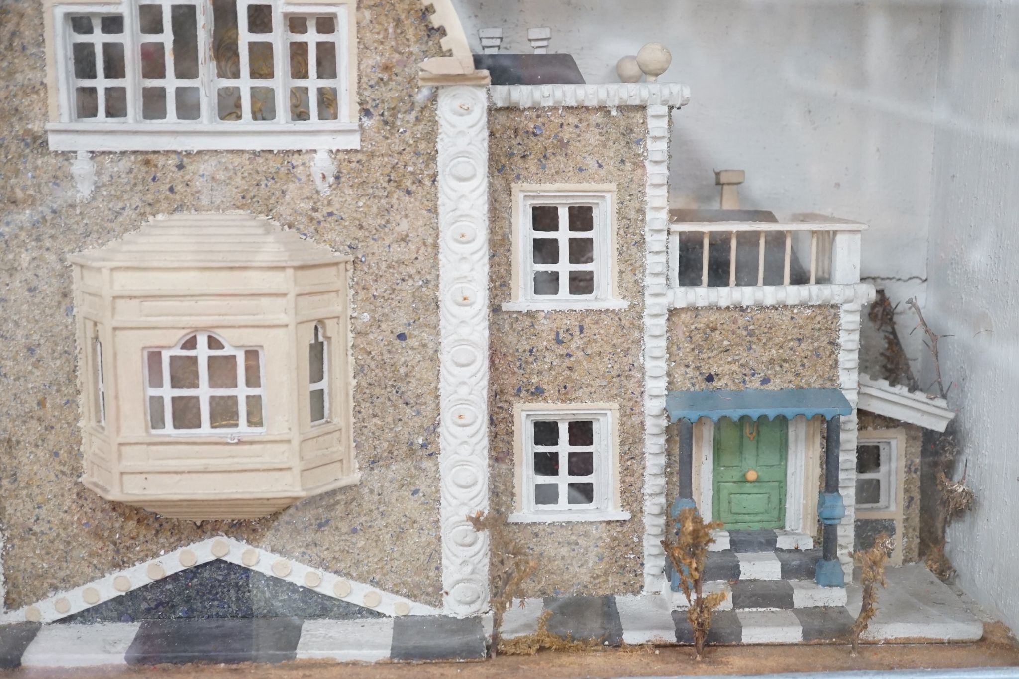 A diorama of a country house, case 63 cm wide